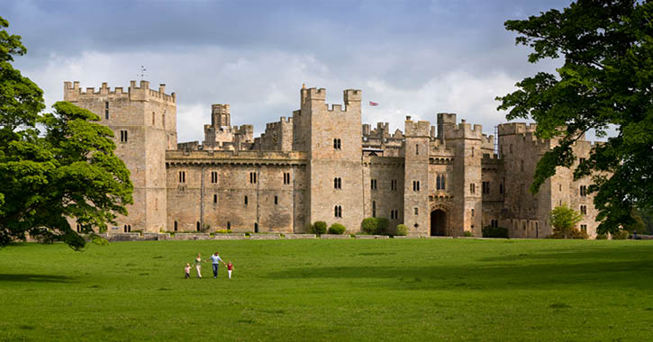 family walking towards Raby Castle